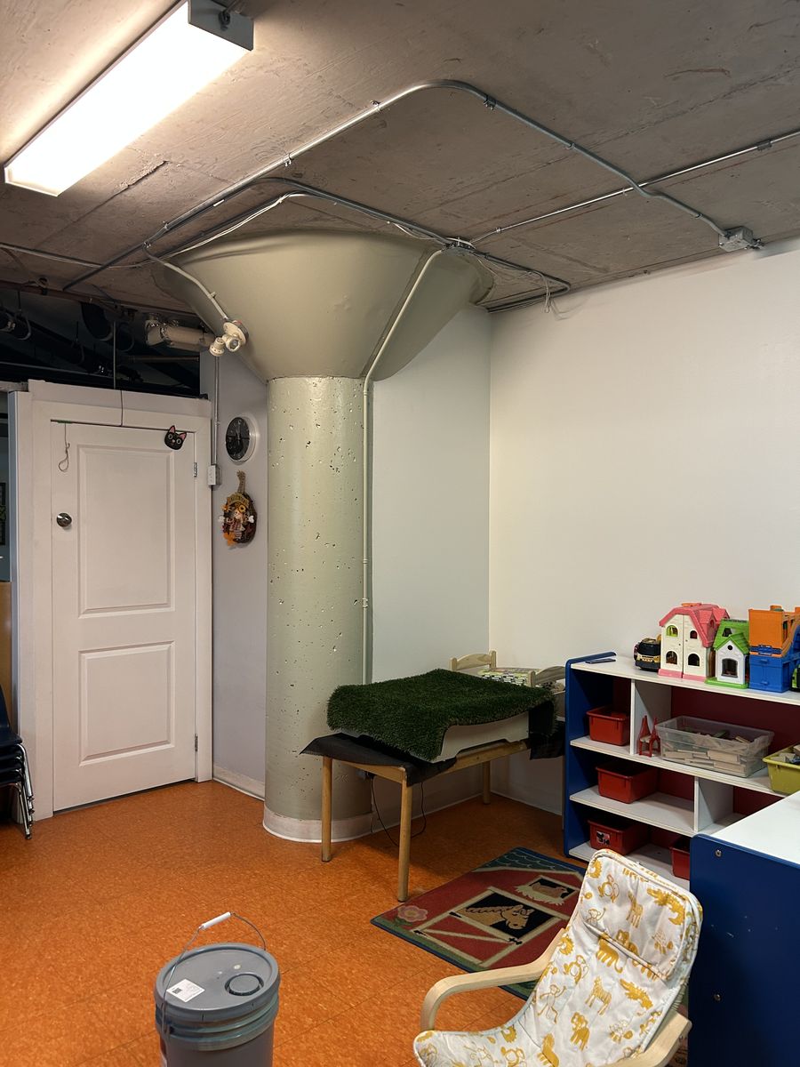 Daycare playroom after: column and walls repainted