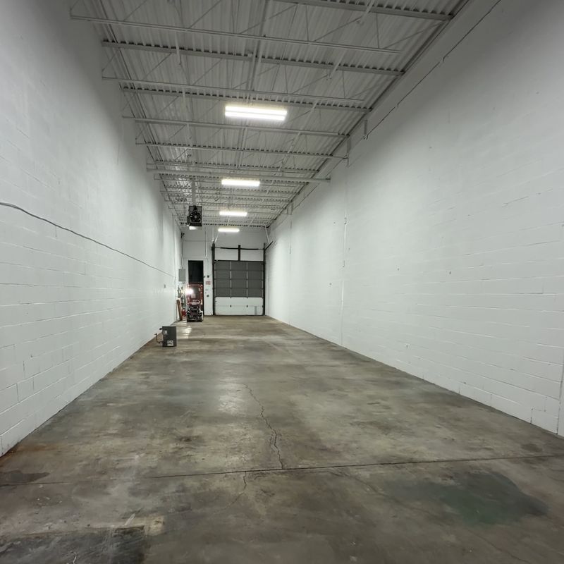 Warehouse unit after painting: bright white block walls